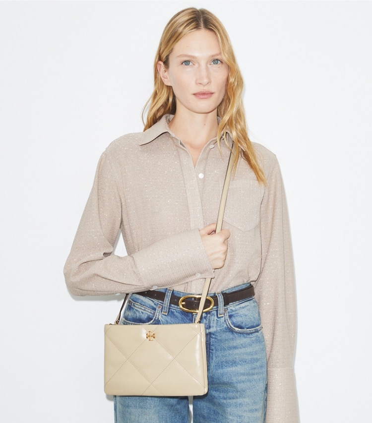 Tory Burch designer crossbody bags Kira Diamond Quilt Crossbody Bag in Light Stone accessory on model