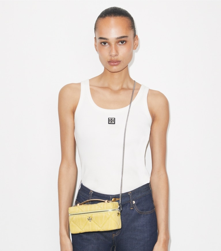 Tory Burch designer mini bags Kira Diamond Quilt Denim Vanity Case in Yellow accessory on model