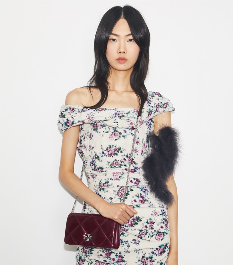 Tory Burch designer mini bags Kira Diamond Quilt Distressed Crossbody in Dark Carmine additional on model