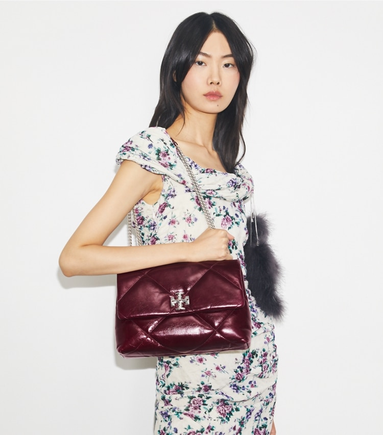 Tory Burch designer shoulder bags Kira Diamond Quilt Distressed Shoulder Bag in Dark Carmine accessory on model