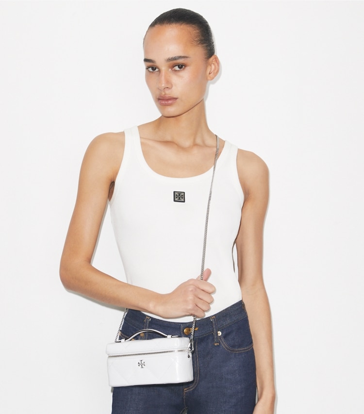 Tory Burch designer mini bags Kira Diamond Quilt Distressed Vanity Case in Cirrus Cloud accessory on model