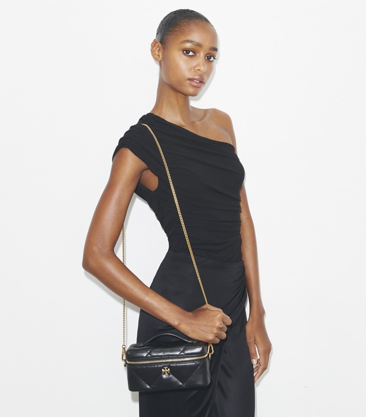 Tory Burch designer mini bags Kira Diamond Quilt East-West Vanity Case in Black accessory on model