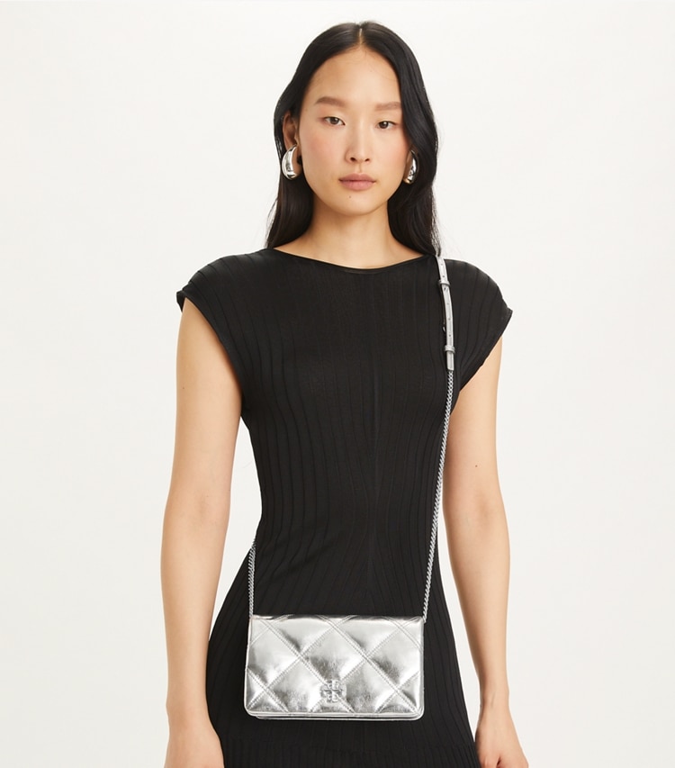 Tory Burch designer mini bags Kira Diamond Quilt Metallic Crossbody in Silver accessory on model
