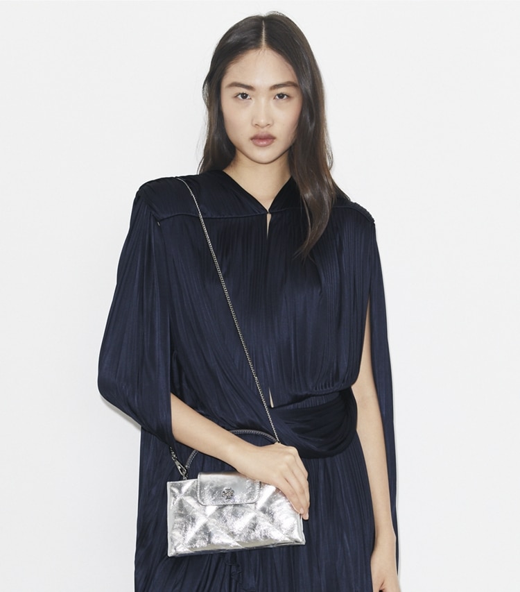 Tory Burch designer mini bags Kira Diamond Quilt Metallic Top-Handle Bag in Silver accessory on model