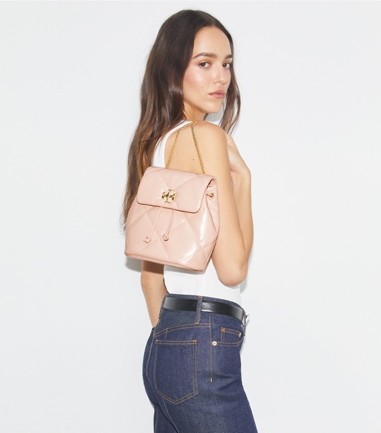 Tory Burch designer backpacks Kira Diamond Quilt Mini Backpack in Soft Pink accessory on model