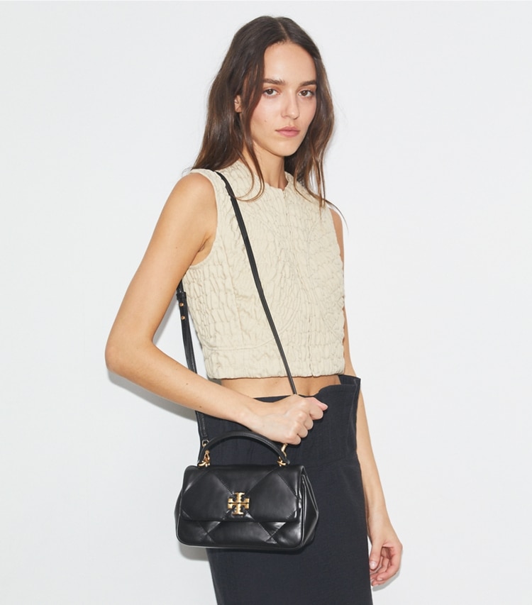 Tory Burch designer crossbody bags Kira Diamond Quilt Top-Handle in Black accessory on model