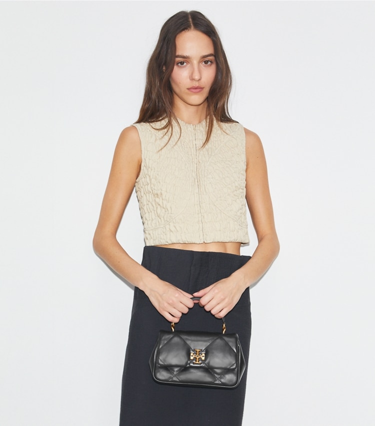 Tory Burch designer crossbody bags Kira Diamond Quilt Top-Handle in Black additional on model