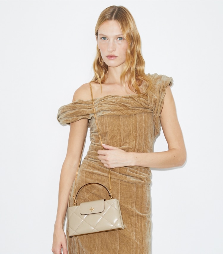 Tory Burch designer mini bags Kira Diamond Quilt Top-Handle Bag in Light Stone accessory on model