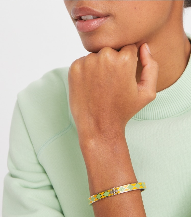 Tory Burch designer bracelets Kira Enamel 7mm Bracelet in Tory Silver / Freesia Yellow / FOLIAGE accessory on model