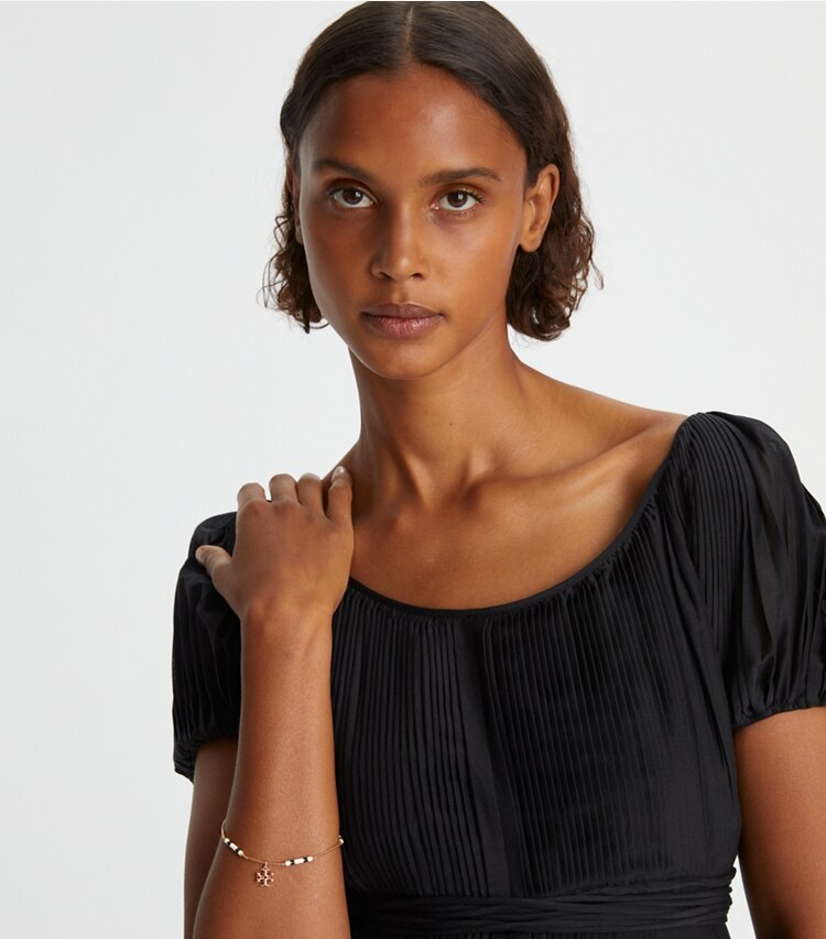 Tory Burch designer bracelets Kira Enamel Bar Bracelet in Tory Gold / New Ivory / Black accessory on model