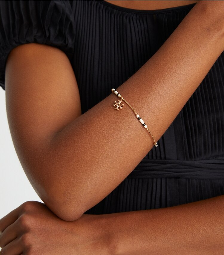 Tory Burch designer bracelets Kira Enamel Bar Bracelet in Tory Gold / New Ivory / Black additional on model
