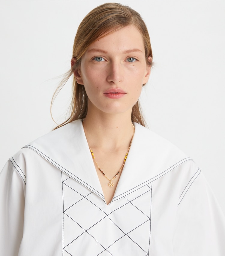 Tory Burch designer necklaces Kira Enamel Bar Pendant Necklace in Tory Gold / Black / New Ivory accessory on model