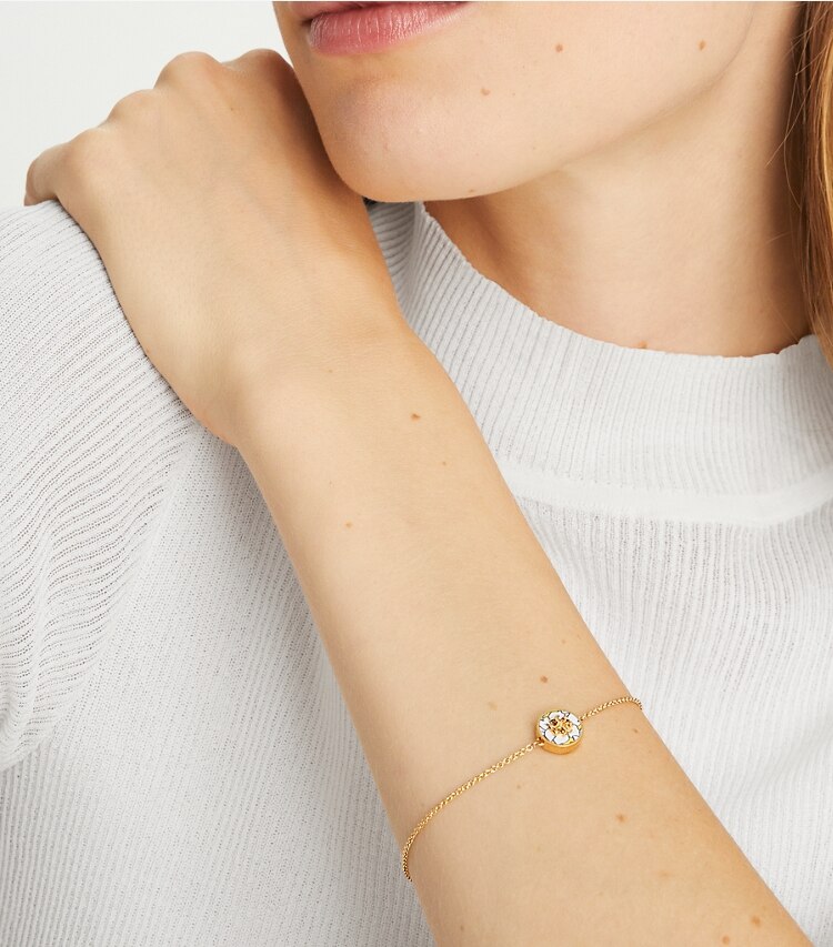 Tory Burch designer bracelets Kira Enamel Printed Chain Bracelet in Tory Gold / Colza Yellow Floral accessory on model