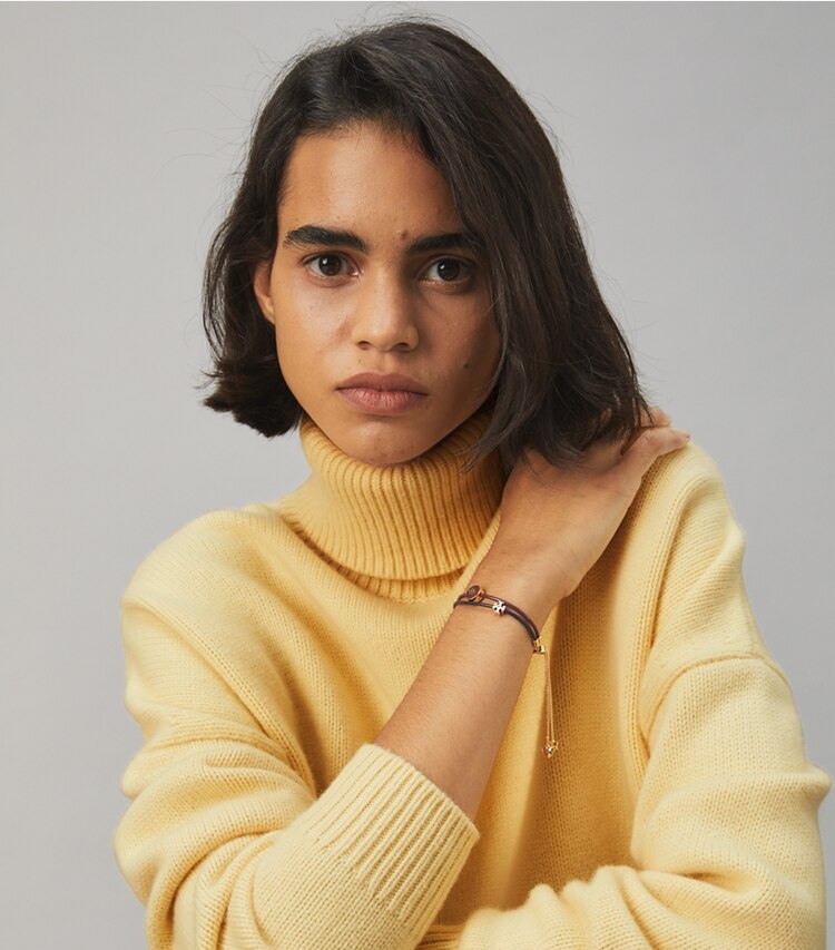 Tory Burch designer bracelets Kira Enamel Slider Bracelet in Tory Gold / Divine Burgundy / Tory Navy accessory on model