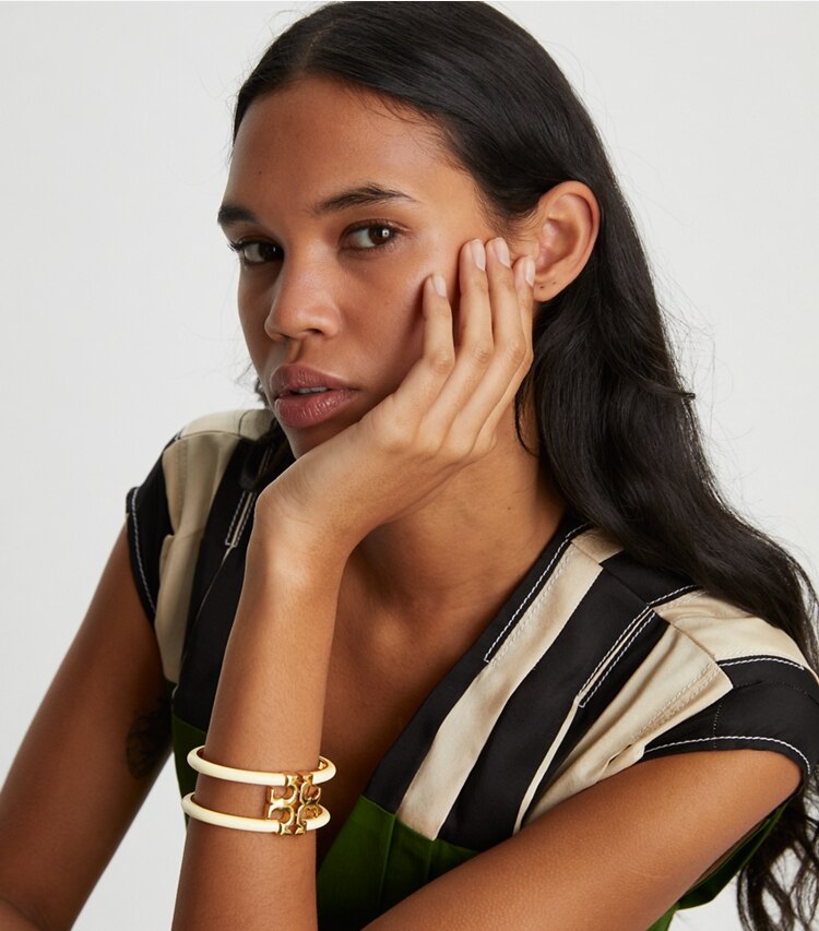 Tory Burch designer bracelets Kira Enamel Wide Bangle in Tory Gold / New Ivory accessory on model
