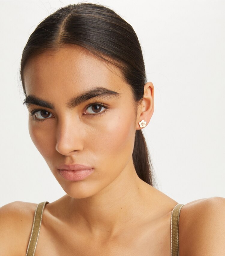 Tory Burch designer earrings Kira Flower Stud Earring in Tory Gold accessory on model