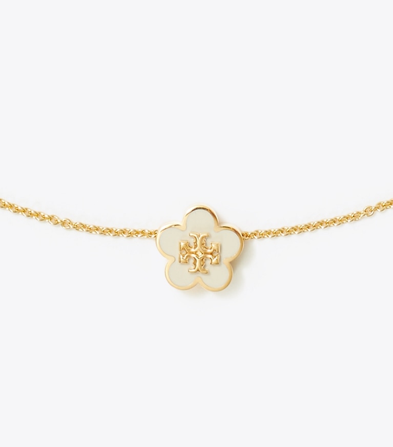Tory Burch designer halsketten Kira Halskette mit Blumenanhänger aus Emaille in Tory Gold / New Ivory front