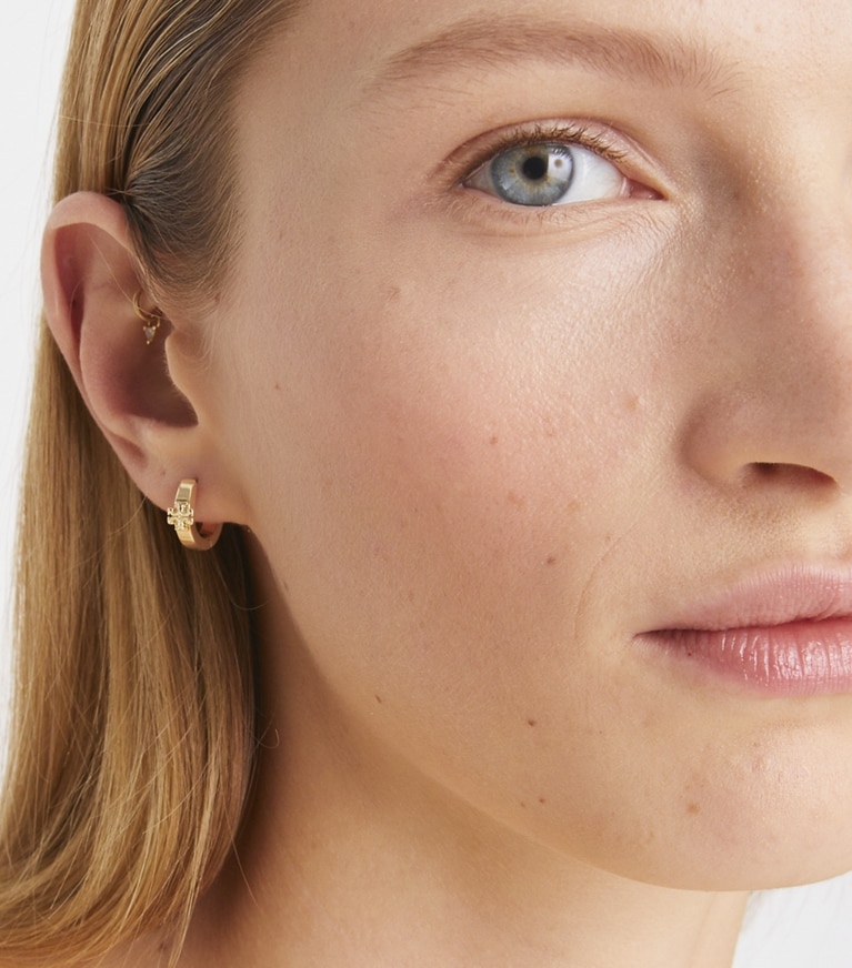 Tory Burch designer earrings Kira Huggie Earrings in Tory Gold front