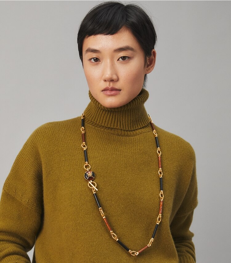 Tory Burch designer necklaces Kira Leather Long Necklace in Rolled Brass / Black / Moose accessory on model