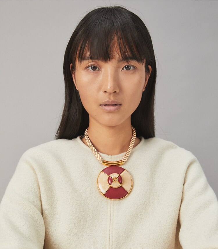 Tory Burch designer necklaces Kira Leather Pendant Necklace in Rolled Brass / Burgundy / Ivory accessory on model
