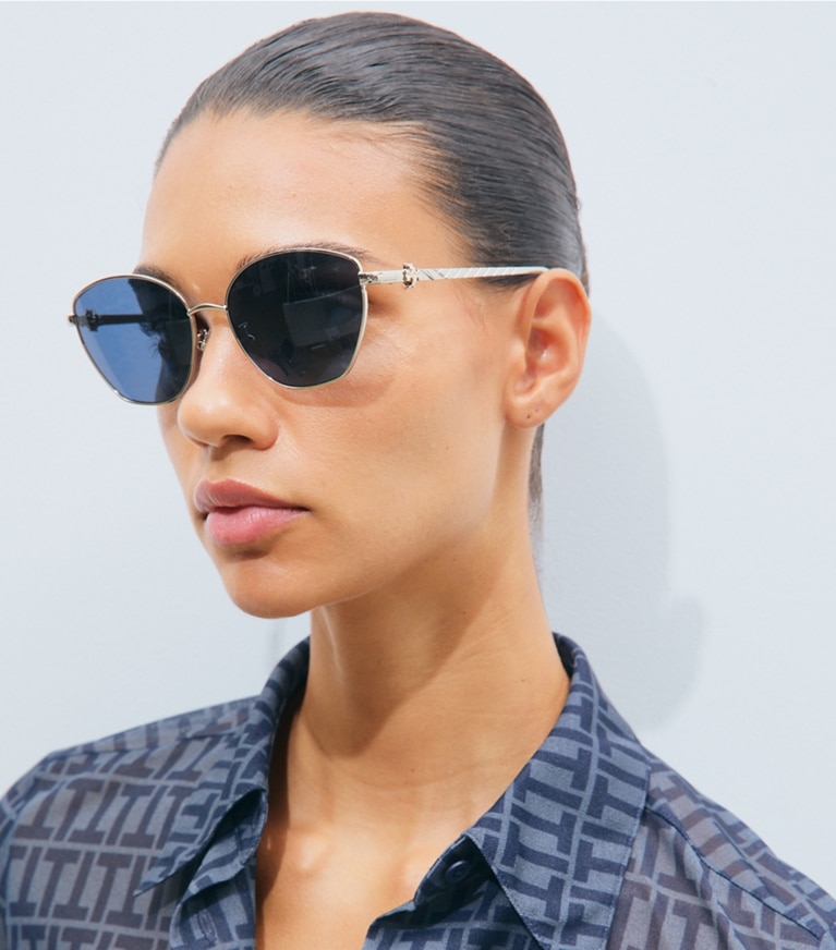 Tory Burch designer sunglasses & eyewear Kira Metal Cat-Eye Sunglasses in LIGHT ROSE GOLD/RED BROWN accessory on model