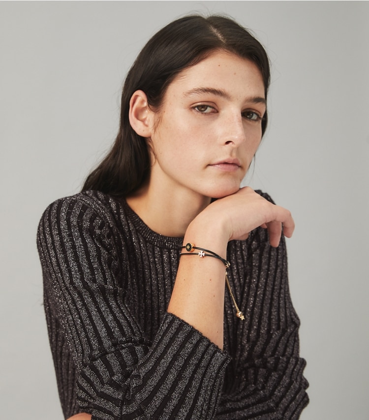 Tory Burch designer bracelets Kira Pavé Slider Bracelet in Tory Gold / New Ivory / Crystal accessory on model