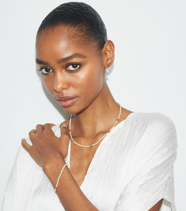 Tory Burch designer bracelets Kira Pearl Bracelet in Tory Gold / Pearl accessory on model