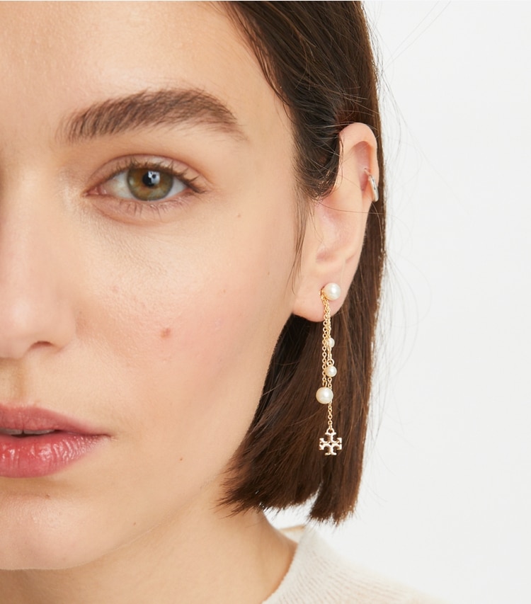 Tory Burch designer earrings Kira Pearl Linear Earring in Tory Gold / Cream accessory on model
