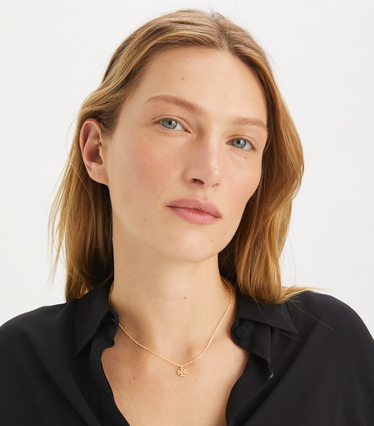 Tory Burch designer necklaces Kira Pendant Necklace in Tory Gold accessory on model
