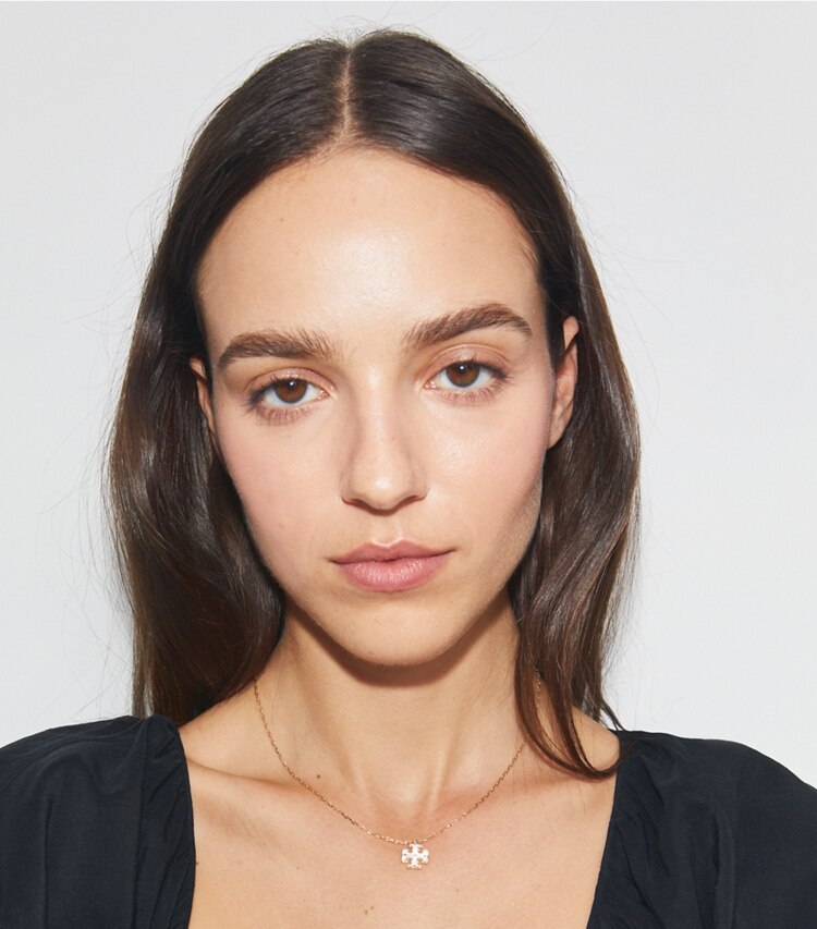 Tory Burch designer necklaces Kira Pendant Necklace in Tory Gold / Mother of Pearl accessory on model