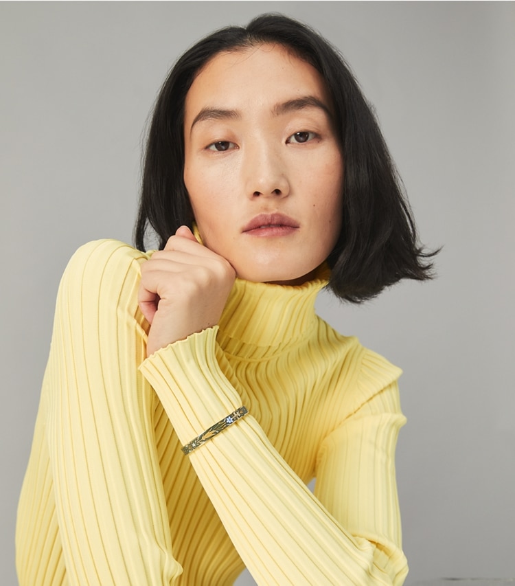 Tory Burch designer bracelets Kira Printed Enameled Bracelet in Tory Gold / Pomegranate Tree Ribbon accessory on model