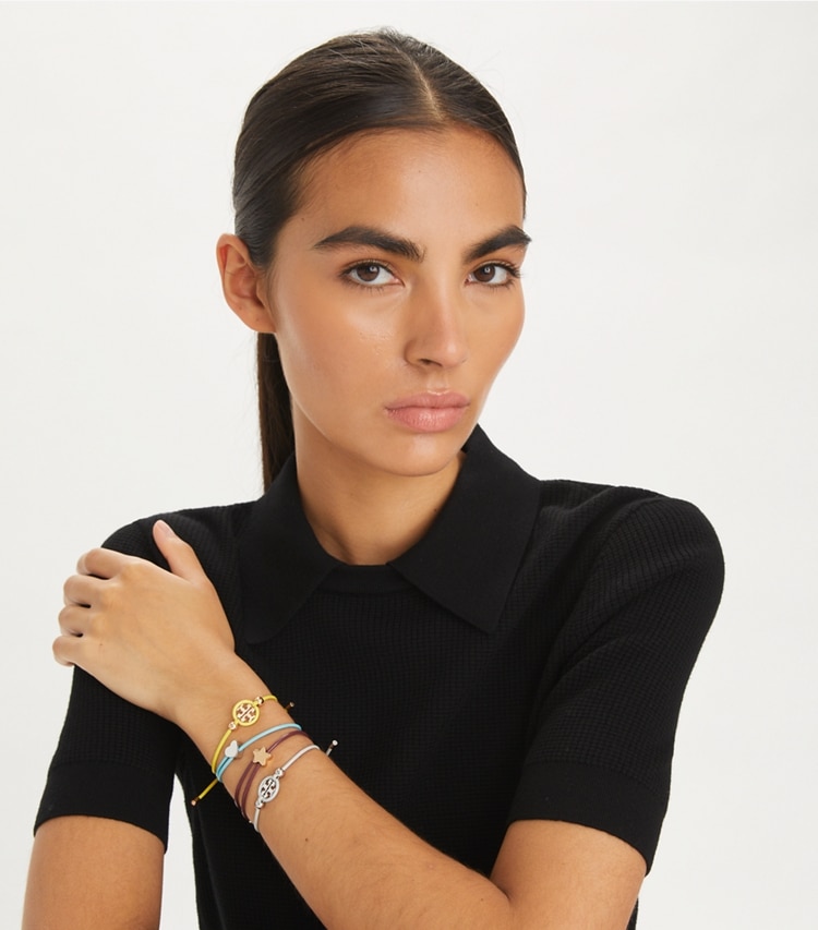 Tory Burch designer bracelets Kira Slider Bracelet in Tory Gold / Brown accessory on model