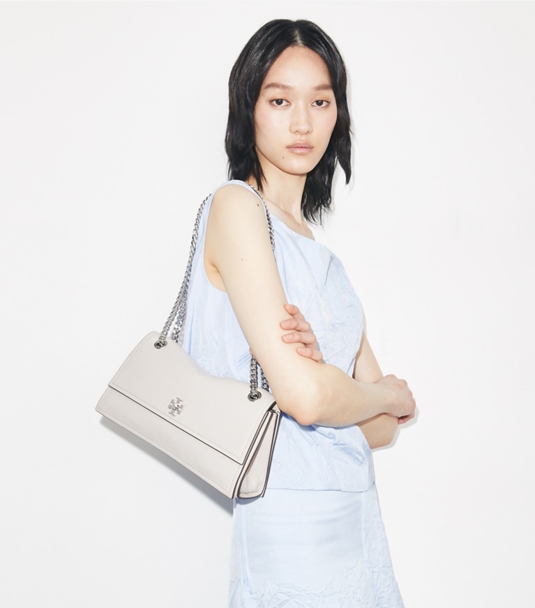 Tory Burch designer shoulder bags Kira Turnlock Shoulder Bag in Dove Gray accessory on model