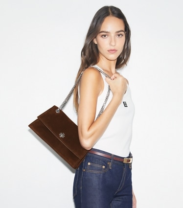 Tory Burch designer shoulder bags Kira Turnlock Suede Shoulder Bag in Dark Cocoa accessory on model