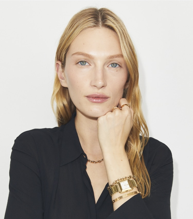 Tory Burch designer strap watches Kira Watch in IVORY/GOLD accessory on model