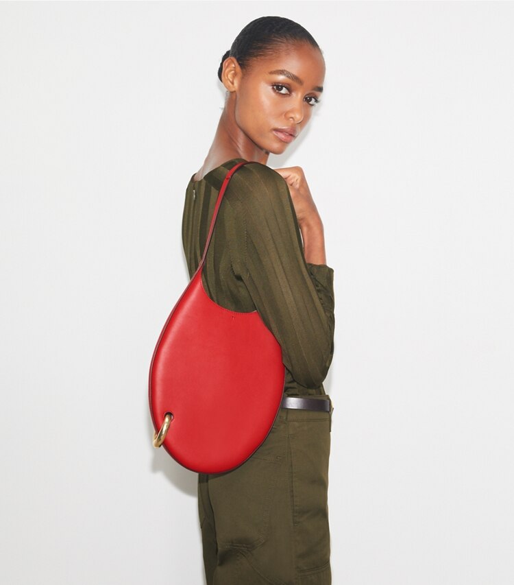 Tory Burch designer schultertaschen Kleine Handtasche mit Piercingdetail in Red Sky accessory on model