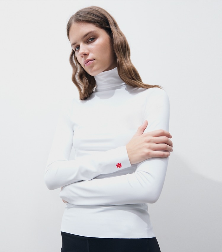 Tory Burch designer tops Knit Turtleneck in Marshmallow on model detail