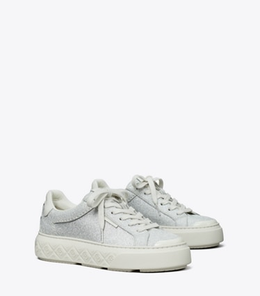 Tory Burch designer sneakers Ladybug Glitter Sneaker in ARGENTO / BLANC angle