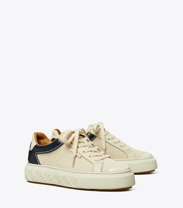 Tory Burch designer sneakers Ladybug Sneaker in LIGHT CREAM / NEW NAVY angle