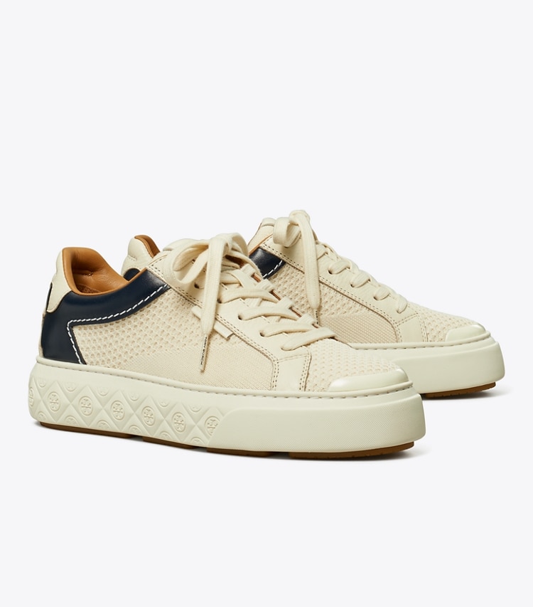 Tory Burch designer sneakers Ladybug Sneaker in LIGHT CREAM / NEW NAVY angle