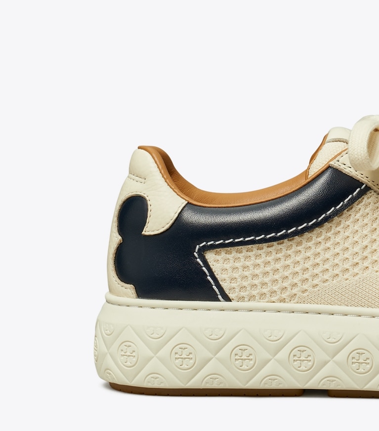 Tory Burch designer sneakers Ladybug Sneaker in LIGHT CREAM / NEW NAVY angle
