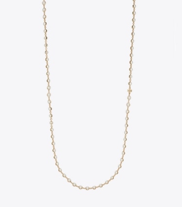 Tory Burch designer halsketten Lange Perlenkette in Light Brass / Pearl front