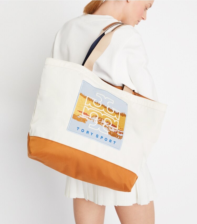 Tory Sport designer tote bags Large Everyday Patch Tote in Parchment / Multi Color accessory on model