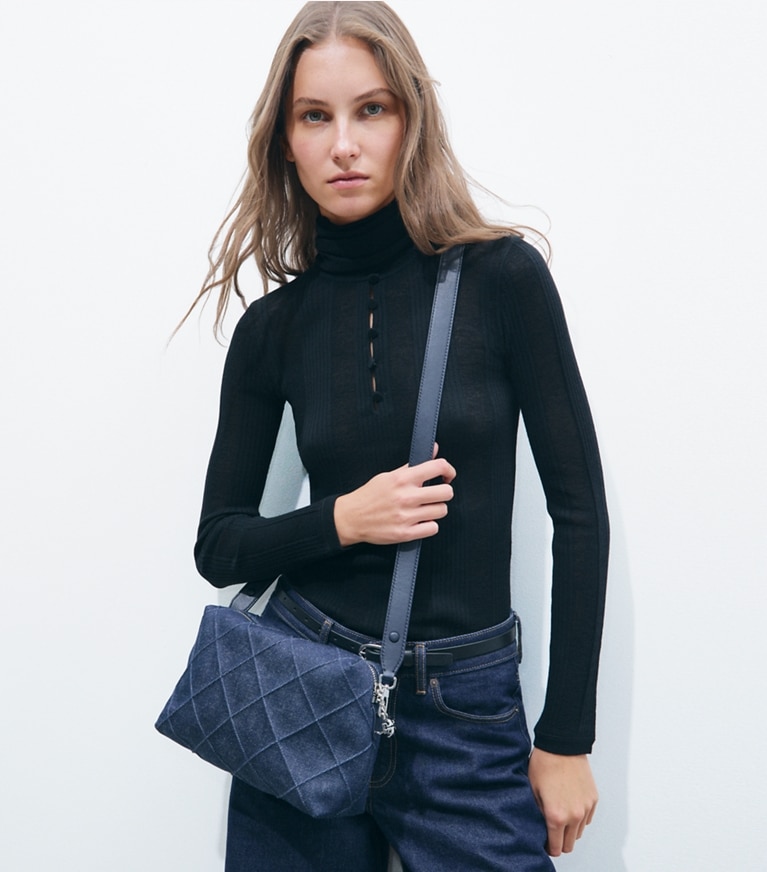Tory Burch designer crossbody bags Large Fleming Denim Soft Crossbody Bag in Blue additional on model