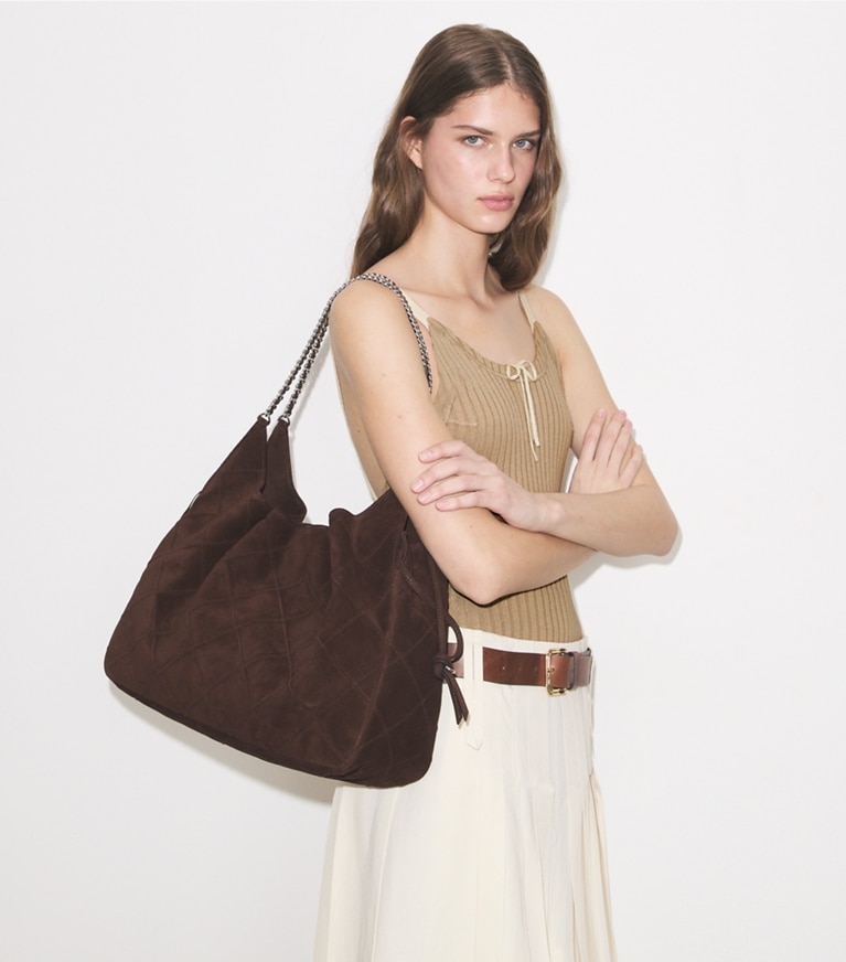 Tory Burch designer tote bags Large Fleming Suede Tote in Dark Cocoa accessory on model