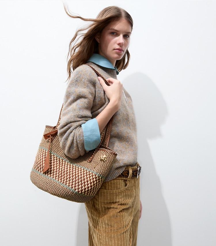 Tory Burch designer tote bags Large Handwoven Basket Tote in Cognac Multi accessory on model