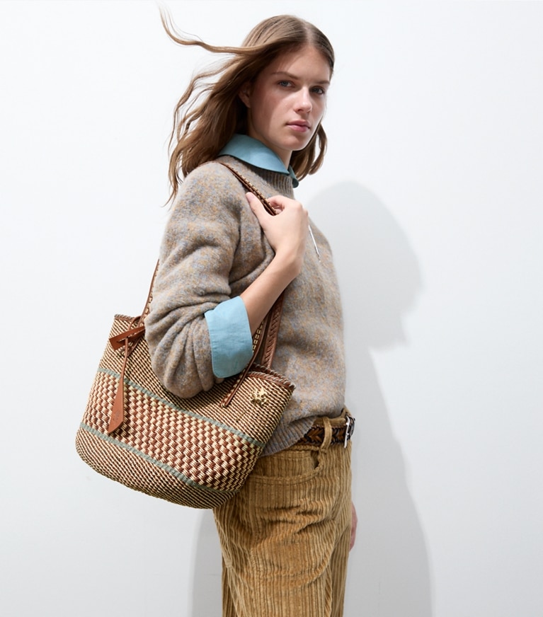 Tory Burch designer tote bags Large Handwoven Basket Tote in Cognac Multi accessory on model
