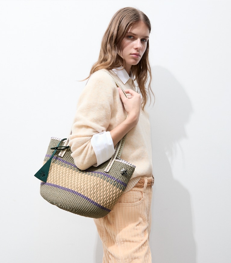 Tory Burch designer tote bags Large Handwoven Basket Tote in Artichoke Multi accessory on model