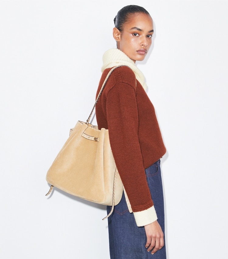 Tory Burch designer shoulder bags Large Romy Suede Pick Stitch Bucket Bag in Butter accessory on model