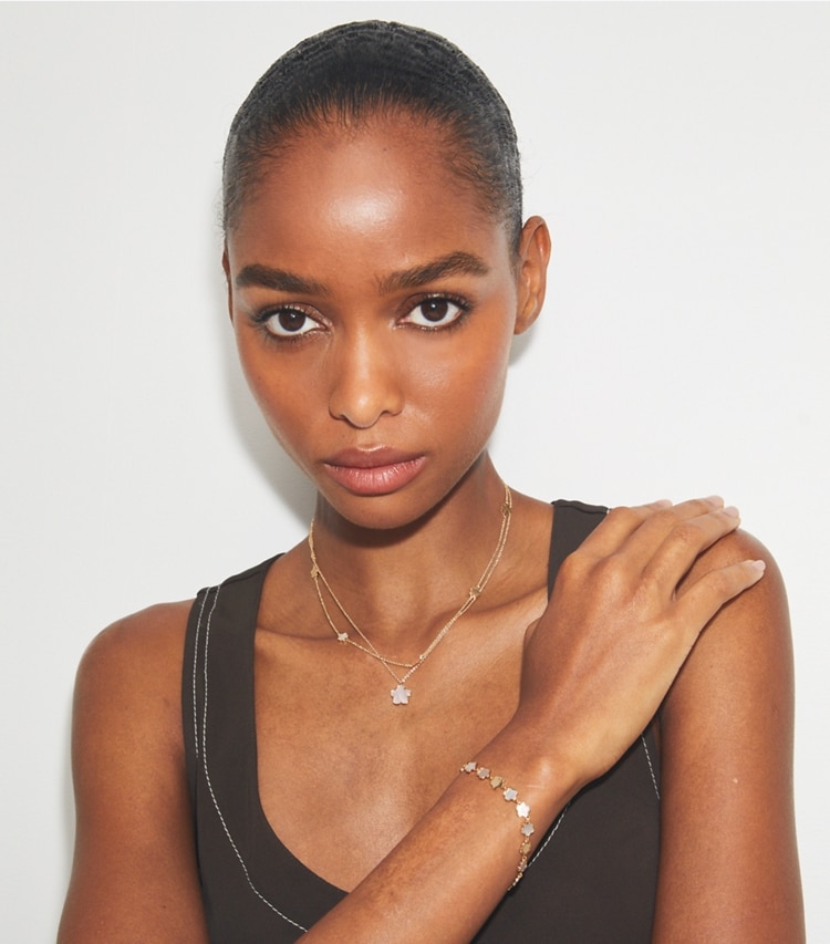 Tory Burch designer necklaces Layered Flower Pendant Necklace in Tory Gold / Mother of Pearl accessory on model